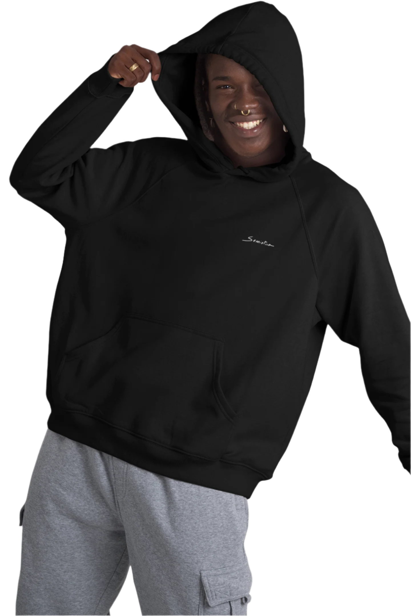 Smiling man with hood up wearing the “Electric Balance” hoodie in black, featuring the Semiotica logo on the chest.