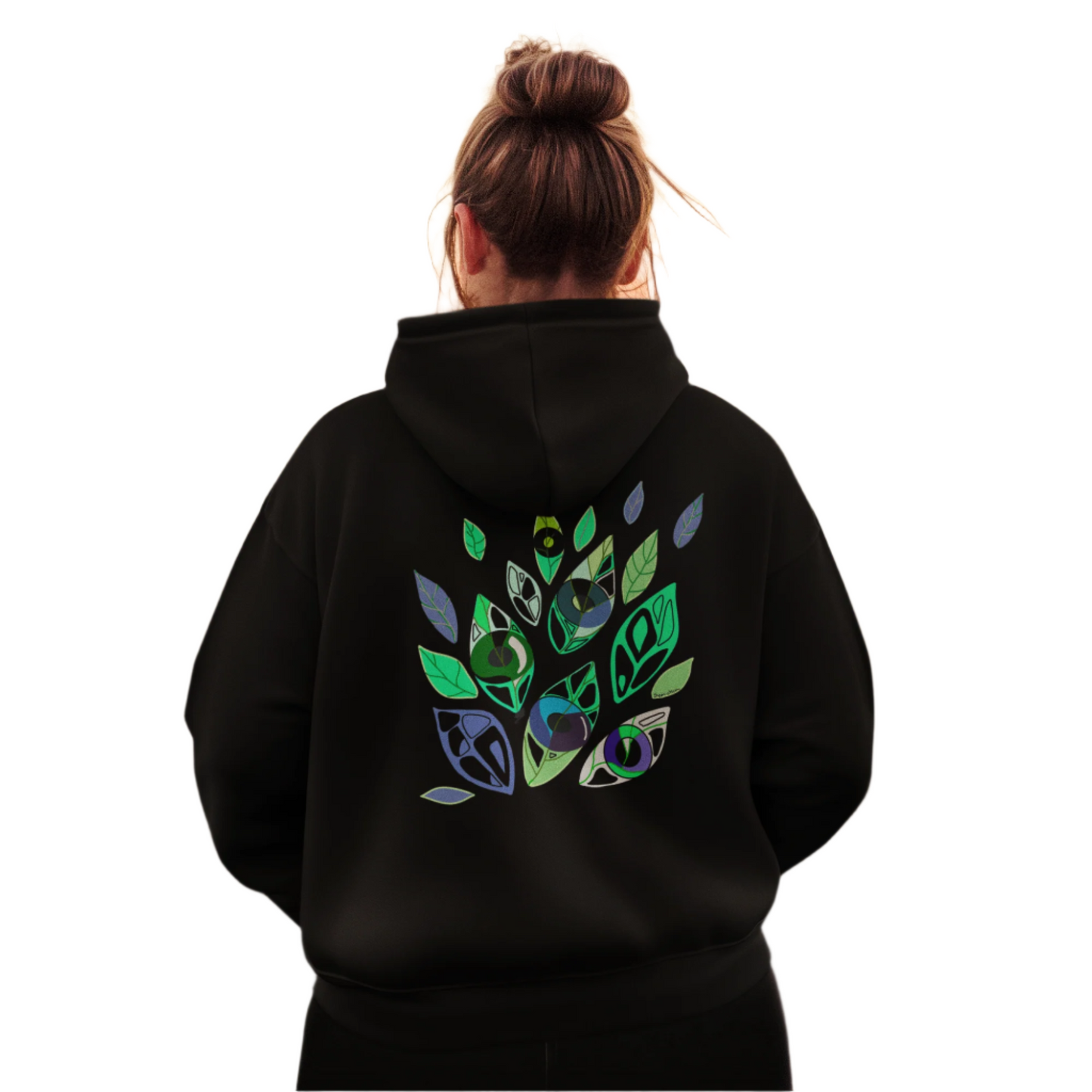 Woman wearing Emotional Botanica hoodie with vibrant symbolic print on the back.