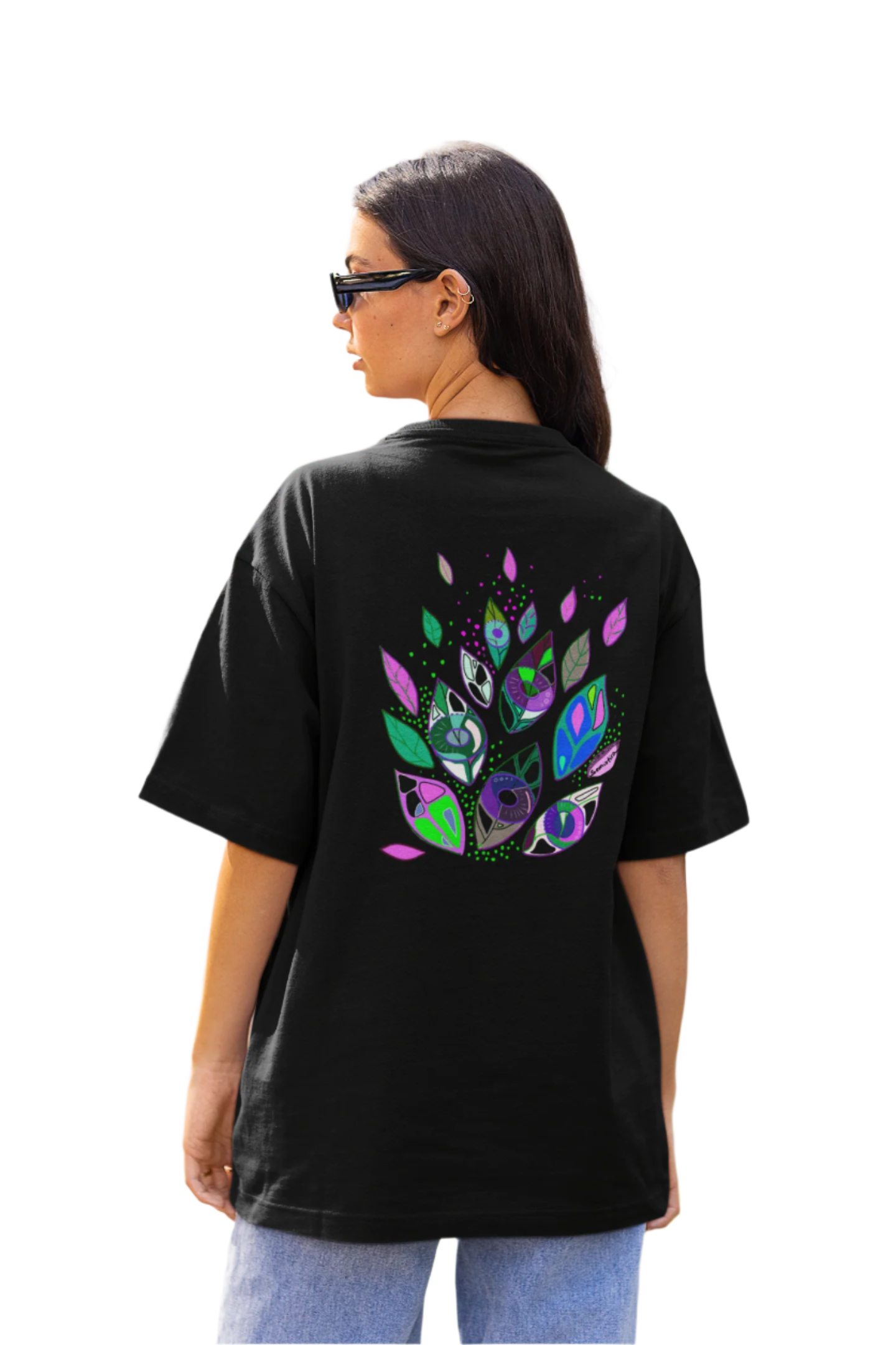 Woman wearing the Seeds of Seeing t-shirt showing the symbolic back design in a relaxed urban look.