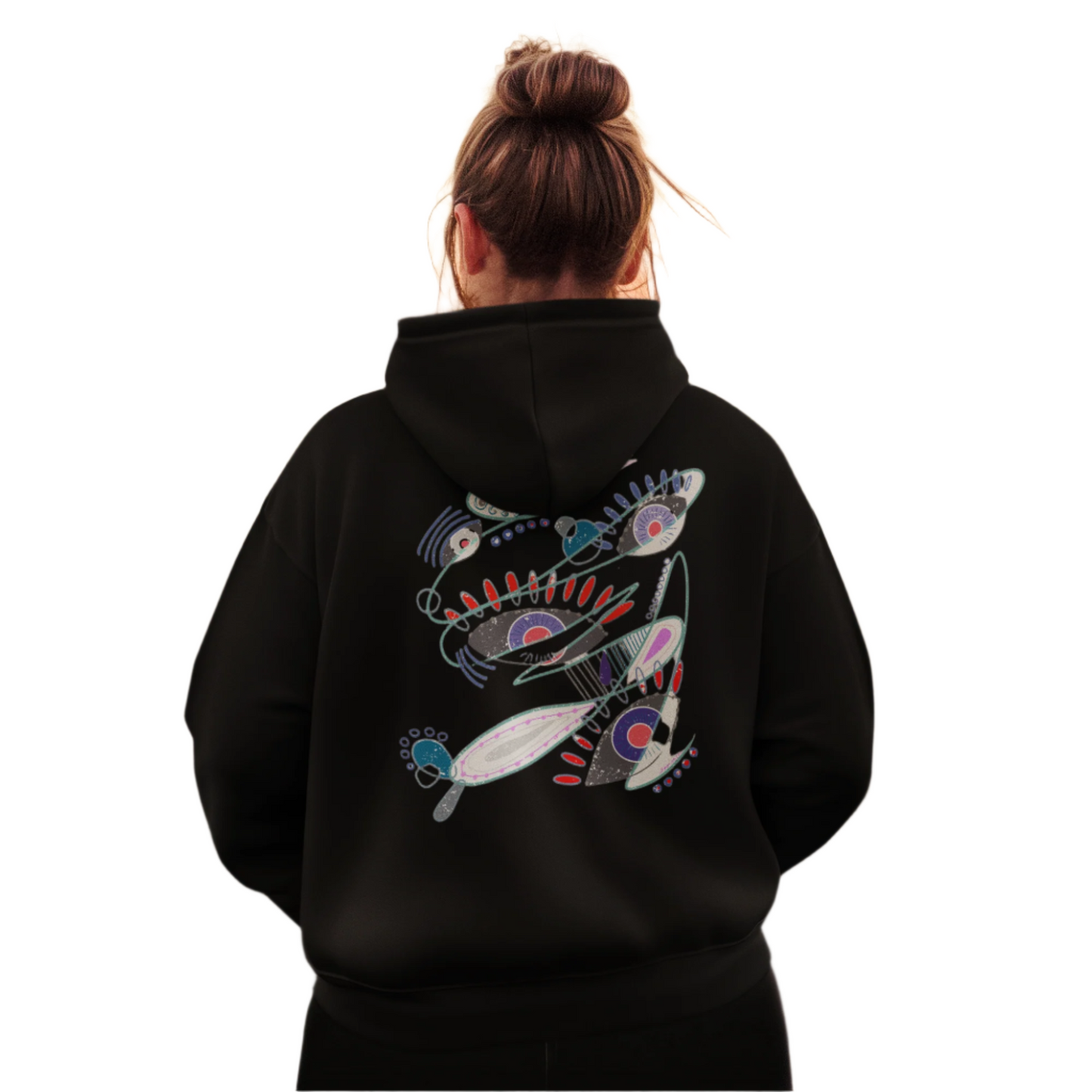 Woman wearing The Dance of Thought black hoodie, showing expressive symbolic design on the back.