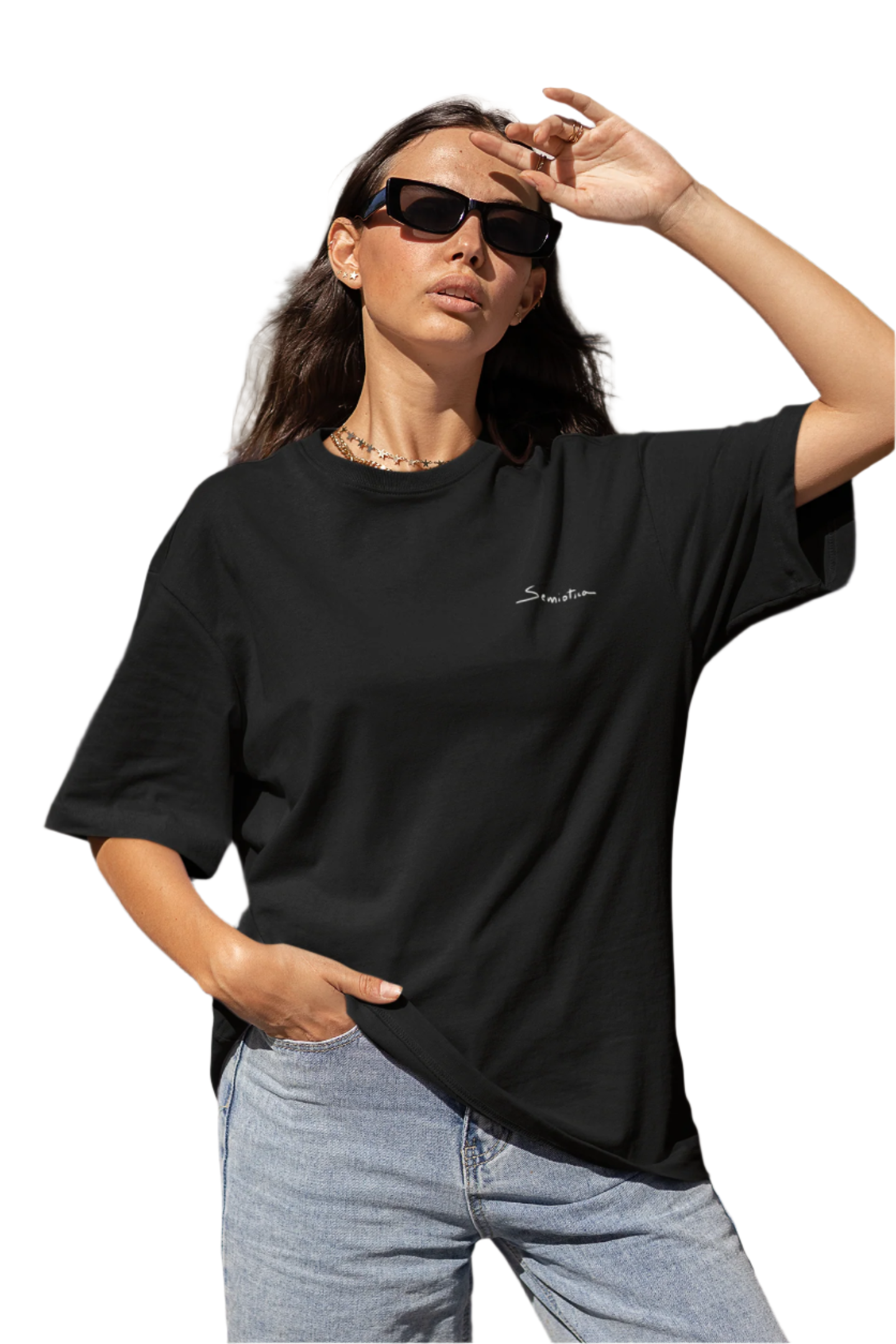 Woman posing in the black "Warrior of Light" T-shirt, showcasing the relaxed oversized fit and minimal front design.