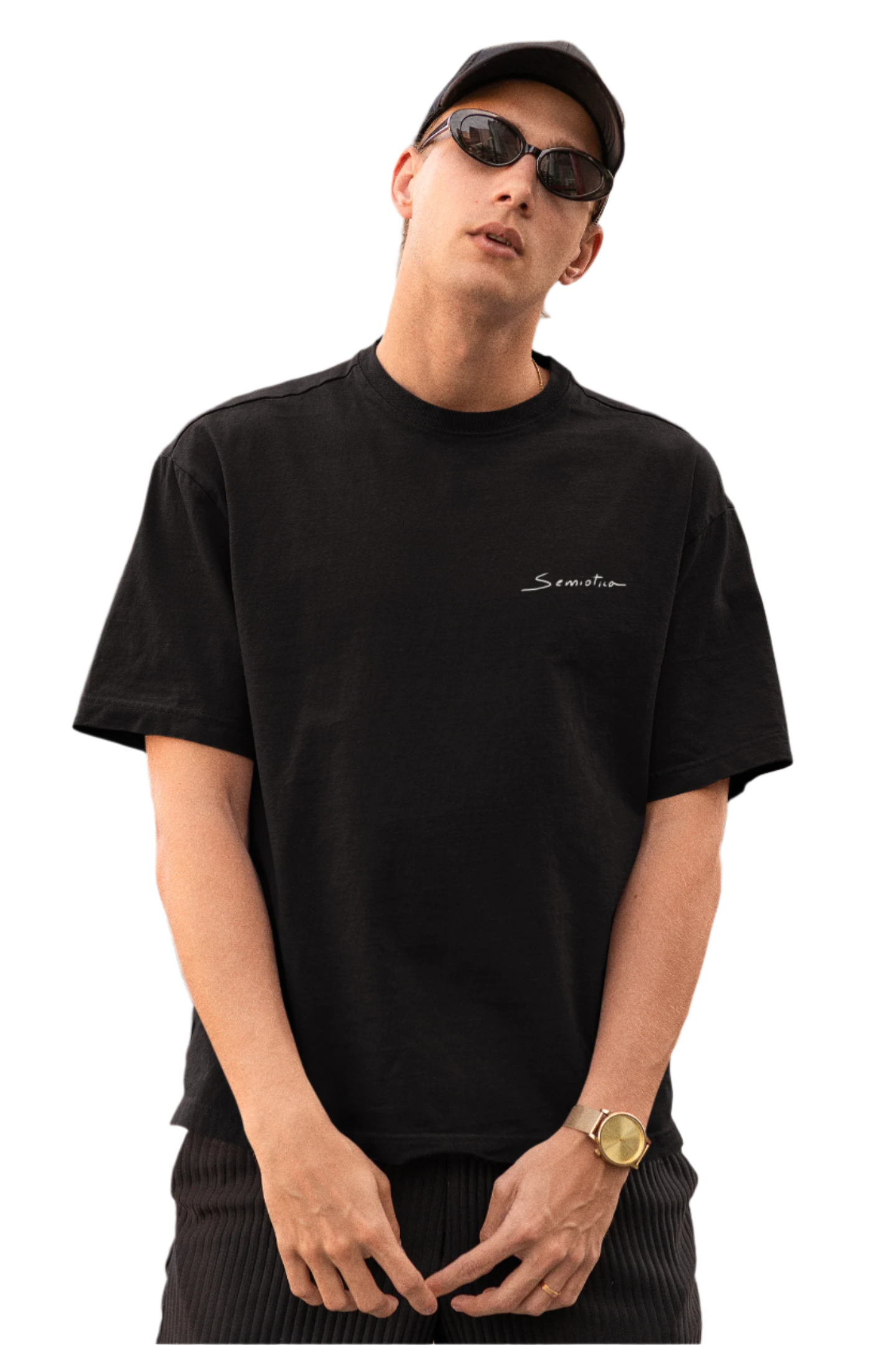 Man in sunglasses wearing the black "Warrior of Light" oversized T-shirt, featuring the subtle Semiotica chest logo.