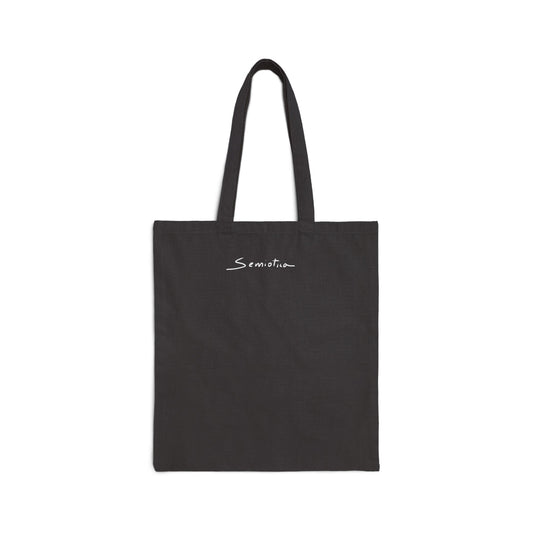 Black tote bag with 'Semiotica' branding on a white background
