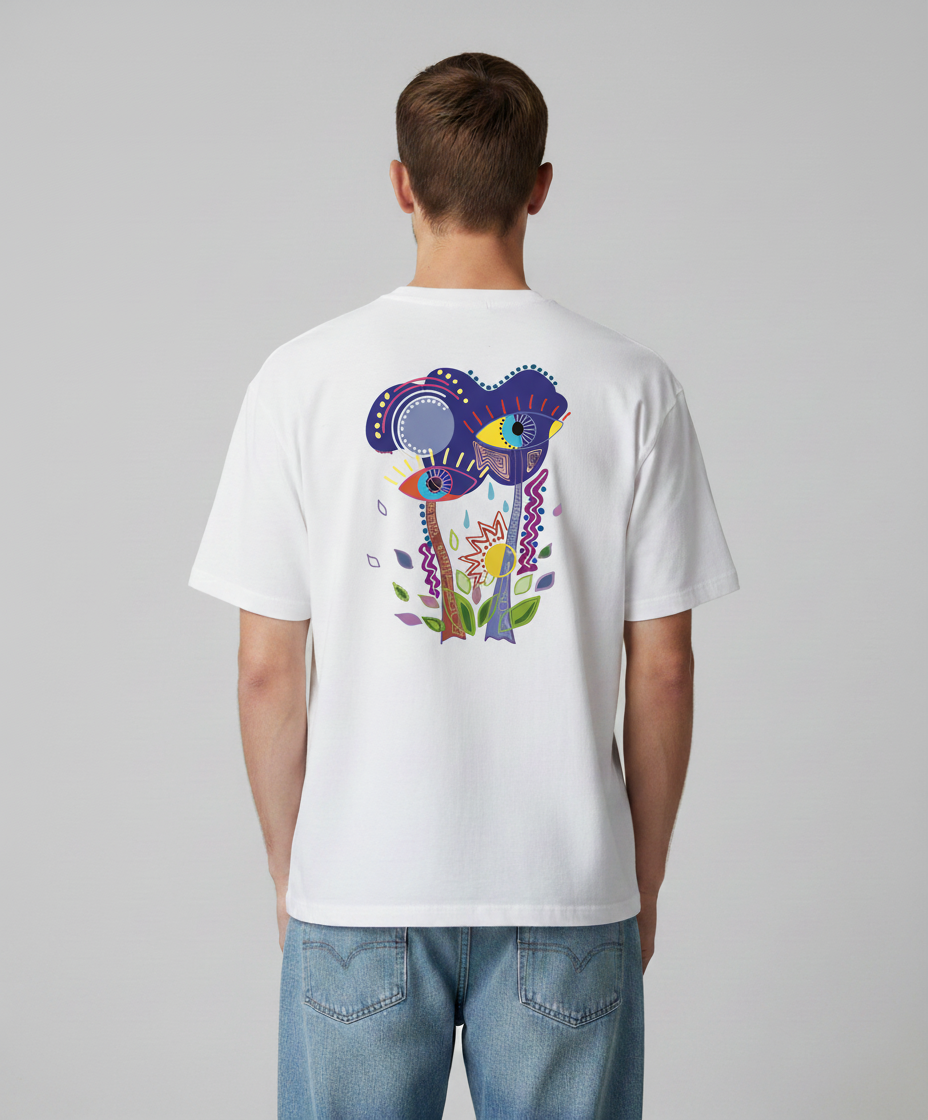 Man wearing a white t-shirt from Semiotica with a colorful design on the back against a gray background