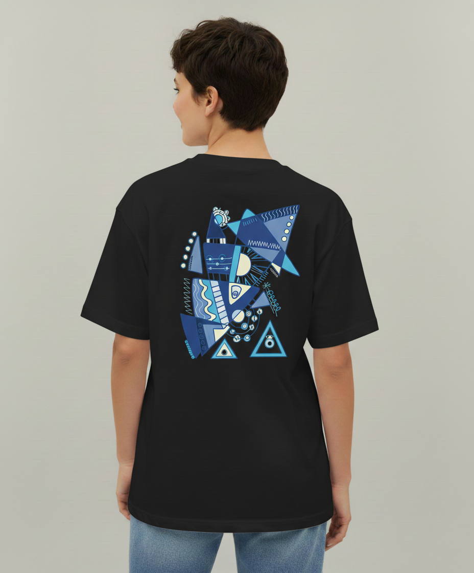 Woman wearing a black t-shirt from Semiotica with blue geometric design on the back against a plain background
