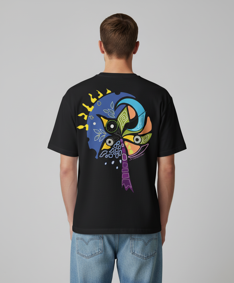 Man wearing a black t-shirt from Semiotica with a colorful graphic design on the back against a gray background