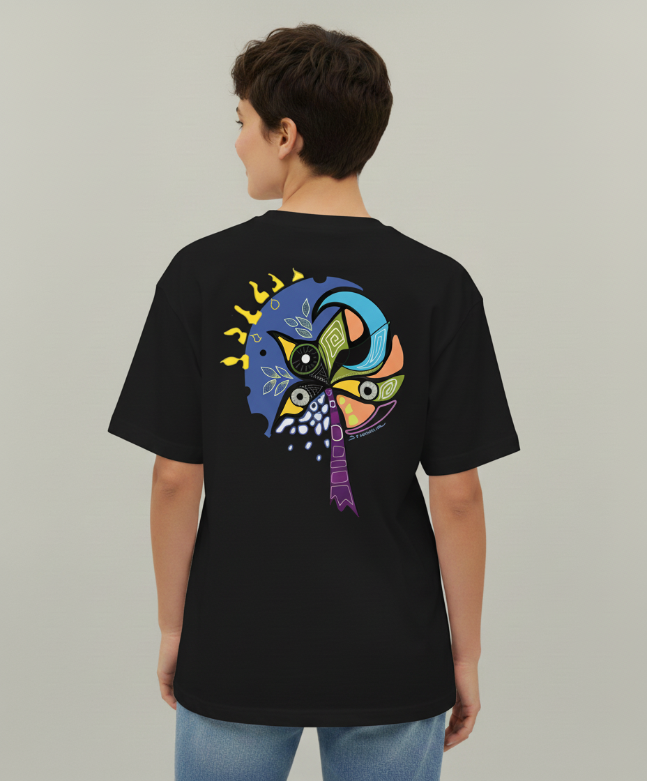 Woman wearing a black t-shirt from Semiotica with a colorful abstract design on the back against a plain background