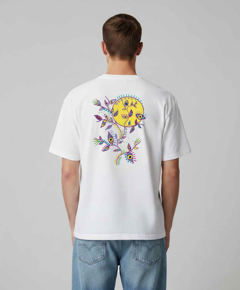Man wearing a white t-shirt from Semiotica with a colorful design on the back against a gray background