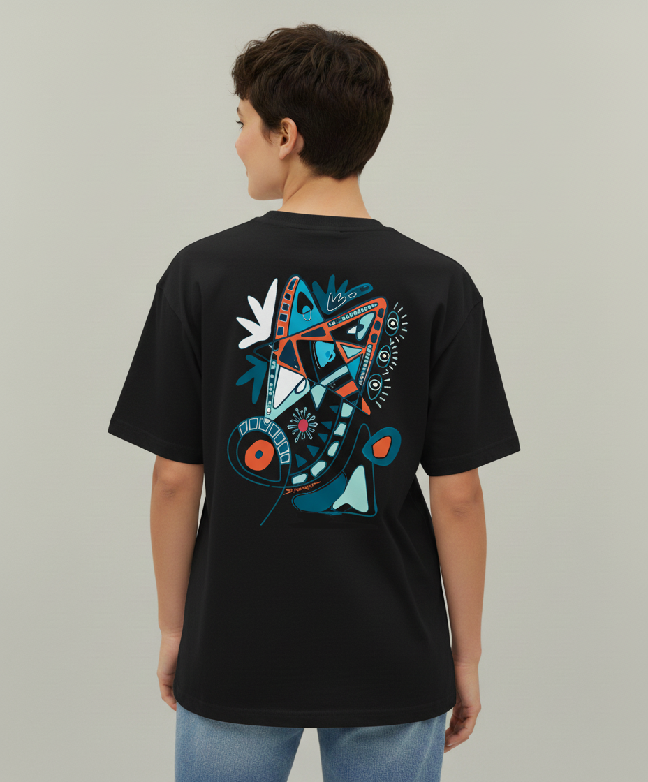 Woman wearing a black t-shirt from Semiotica with a colorful graphic design on the back against a plain background