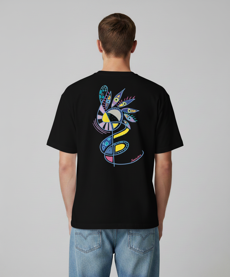 Man wearing a black t-shirt from Semiotica with a colorful abstract design on the back, standing against a plain background.