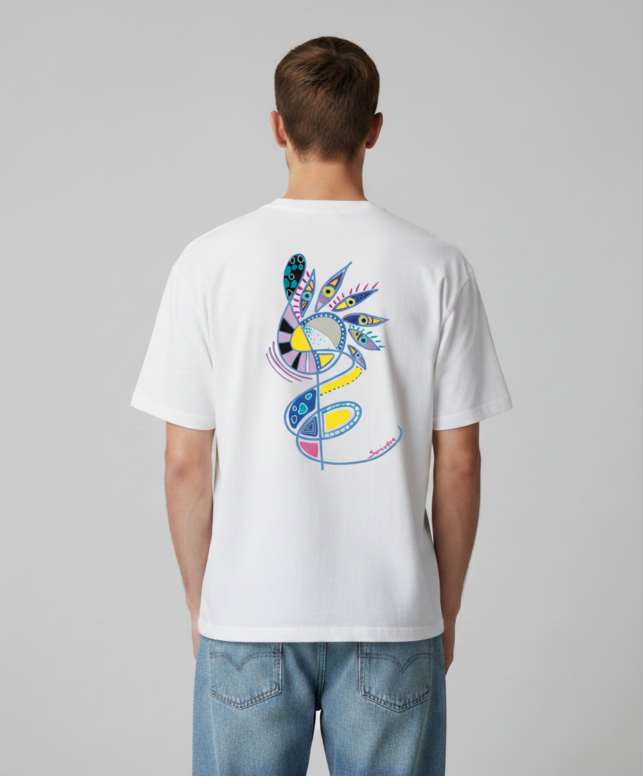 Man wearing a white t-shirt from Semiotica with a colorful design on the back against a gray background
