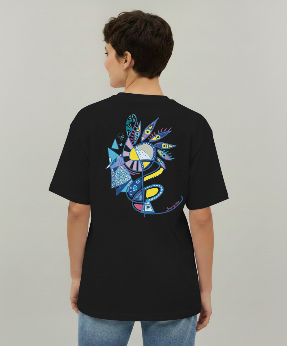 Woman wearing a black t-shirt from Semiotica with a colorful abstract design on the back against a plain background